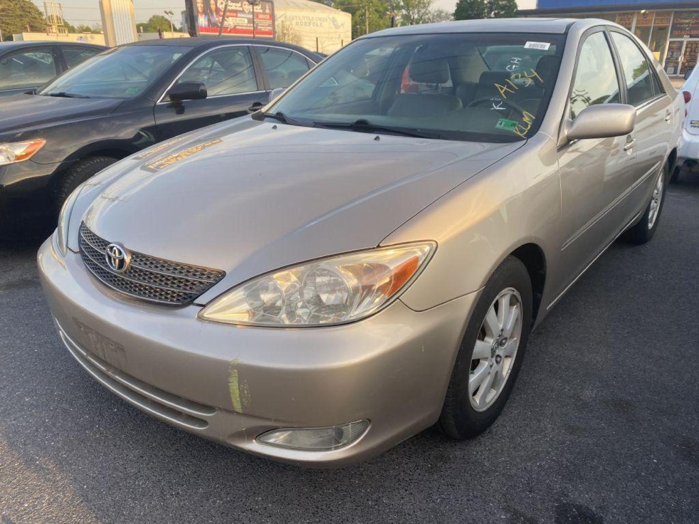 2004 GOLD TOYOTA CAMRY LE (4T1BF30K24U) with an 3.0L engine, Automatic transmission, located at 930 E Little Creek Road, Norfolk, VA, 23518, (757) 588-0420, 36.915051, -76.244408 - Photo#0